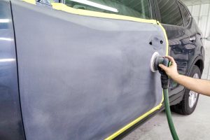 Sanding a car door for painting