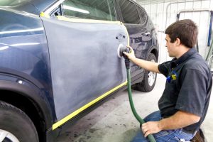 Sanding a car door for painting