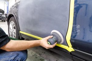 Sanding a car door for painting